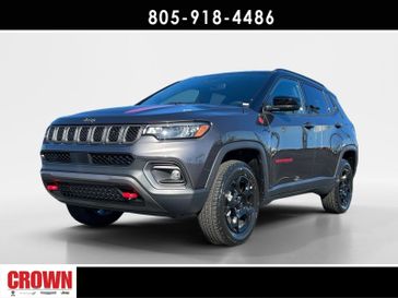 2024 Jeep Compass Trailhawk in a Granite exterior color and Ruby Red/Blackinterior. Ventura Auto Center 866-978-2178 venturaautocenter.com 