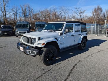 2024 Jeep Wrangler 4xe 4 Door Sahara in a Bright White Clear Coat exterior color and Blackinterior. Don White's Timonium Chrysler Dodge Jeep Ram 410-881-5409 donwhites.com 