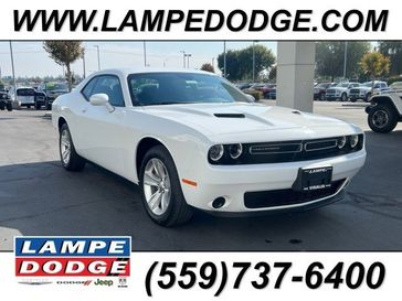 2023 Dodge Challenger SXT in a White Knuckle exterior color and Blackinterior. Lampe Chrysler Dodge Jeep RAM 559-471-3085 pixelmotiondemo.com 