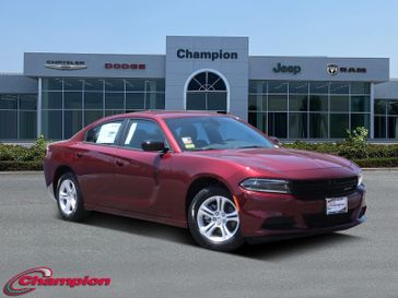 2023 Dodge Charger SXT Rwd in a Octane Red exterior color and HOUNDSTOOTHinterior. Champion Chrysler Jeep Dodge Ram 800-549-1084 pixelmotiondemo.com 