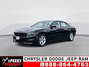 2021 Dodge Charger SXT in a Pitch Black Clear Coat exterior color and Blackinterior. McPeek's Chrysler Dodge Jeep Ram of Anaheim 888-861-6929 mcpeeksdodgeanaheim.com 