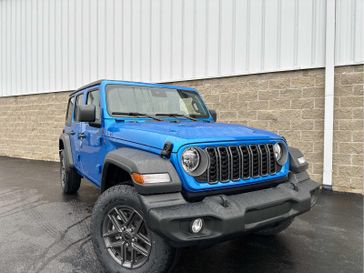 2024 Jeep Wrangler 4-door Sport S in a Hydro Blue Pearl Coat exterior color and Blackinterior. Wilmington Auto Center Chrysler Dodge Jeep Ram (937) 556-6430 wilmingtonautocentercdjr.com 