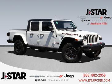 2022 Jeep Gladiator Rubicon in a Bright White Clear Coat exterior color and Blackinterior. J Star Chrysler Dodge Jeep Ram of Anaheim Hills 888-802-2956 jstarcdjrofanaheimhills.com 