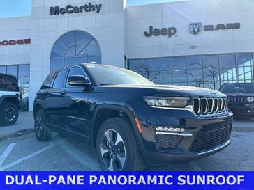 2024 Jeep Grand Cherokee 4xe in a Midnight Sky exterior color and Global Blackinterior. McCarthy Jeep Ram 816-434-0674 mccarthyjeepram.com 
