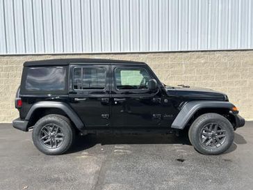 2024 Jeep Wrangler 4-door Sport S in a Black Clear Coat exterior color and Blackinterior. Wilmington Auto Center Chrysler Dodge Jeep Ram (937) 556-6430 wilmingtonautocentercdjr.com 