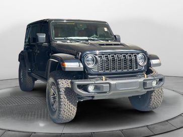 2024 Jeep Wrangler 4-door Rubicon 392 in a Black Clear Coat exterior color and Red/Blackinterior. Stan McNabb Chrysler Dodge Jeep Ram FIAT 931-408-9662 stanmcnabbcdjr.com 