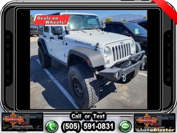 2015 Jeep Wrangler Unlimited Rubicon in a Bright White Clear Coat exterior color and Blackinterior. Melloy Dodge RAM FIAT 505-588-4459 melloydodge.com 