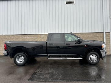 2024 RAM 3500 Tradesman Crew Cab 4x4 8' Box in a Diamond Black Crystal Pearl Coat exterior color. Wilmington Auto Center Chrysler Dodge Jeep Ram (937) 556-6430 wilmingtonautocentercdjr.com 