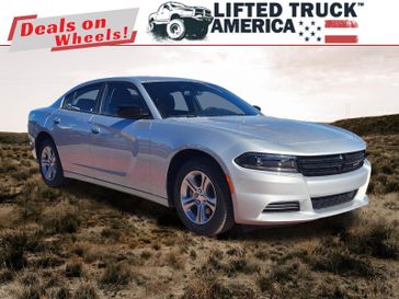 2023 Dodge Charger SXT in a Triple Nickel Clear Coat exterior color and Blackinterior. Lifted Truck America 888-267-0644 liftedtruckamerica.com 