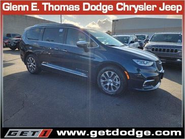 2024 Chrysler Pacifica Plug-in Hybrid Pinnacle in a Fathom Blue Pearl Coat exterior color and Sepia/Blackinterior. Glenn E Thomas 100 Years Of Excellence (866) 340-5075 getdodge.com 