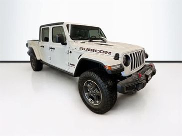 2023 Jeep Gladiator Rubicon 4x4 in a Bright White Clear Coat exterior color and Blackinterior. Sheridan Motors CDJR 307-218-2217 sheridanmotor.com 