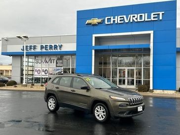 2015 Jeep Cherokee Sport in a Eco Green Pearl Coat exterior color and Blackinterior. Jeff Perry Chrysler Jeep 815-859-8394 jeffperrychryslerjeep.com 
