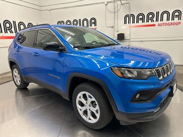 2024 Jeep Compass Latitude 4x4 in a Laser Blue Pearl Coat exterior color. Marina Auto Group (855) 564-8688 marinaautogroup.com 