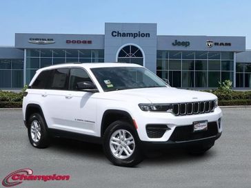 2023 Jeep Grand Cherokee Laredo 4x2 in a Bright White Clear Coat exterior color and CLOTHinterior. Champion Chrysler Jeep Dodge Ram 800-549-1084 pixelmotiondemo.com 