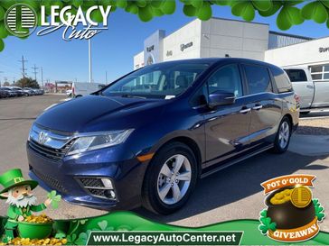 2019 Honda Odyssey EX-L in a Obsidian Blue Pearl exterior color and Grayinterior. Legacy Auto Center 620-315-9264 legacyautocenter.net 