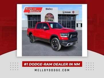 2021 RAM 1500 Rebel in a Flame Red Clear Coat exterior color and Blackinterior. Melloy Dodge RAM FIAT 505-588-4459 melloydodge.com 