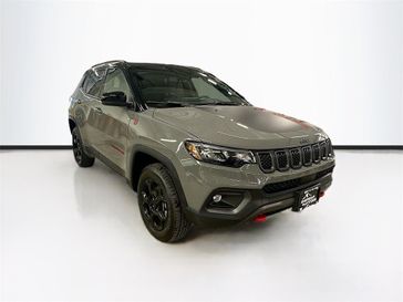 2023 Jeep Compass Trailhawk 4x4 in a Sting-Gray Clear Coat exterior color and Ruby Red/Blackinterior. Sheridan Motors CDJR 307-218-2217 sheridanmotor.com 