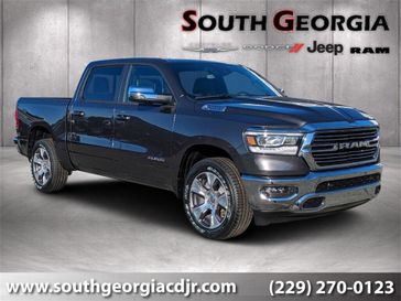 2024 RAM 1500 Laramie Crew Cab 4x4 5'7' Box in a Granite Crystal Metallic Clear Coat exterior color and Blackinterior. South Georgia CDJR 229-443-1466 southgeorgiacdjr.com 