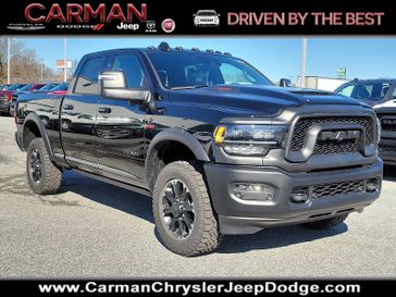 2024 RAM 2500 Rebel Crew Cab 4x4 6'4' Box in a Diamond Black Crystal Pearl Coat exterior color and Blackinterior. Carman Chrysler Jeep Dodge Ram 302-317-2378 carmanchryslerjeepdodge.com 