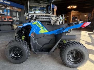 2025 Polaris OUTLAW 70 EFI in a VELOCITY BLUE / LIFTED LIME exterior color. Iron Supply Powersports (281) 524-2455 ironsupply.com 