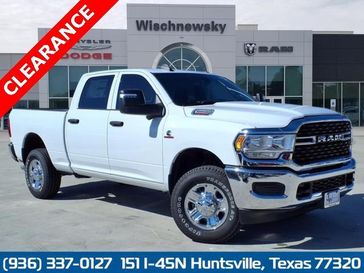 2024 RAM 2500 Tradesman Crew Cab 4x4 6'4' Box in a Bright White Clear Coat exterior color and Blackinterior. Wischnewsky Dodge 936-755-5310 wischnewskydodge.com 