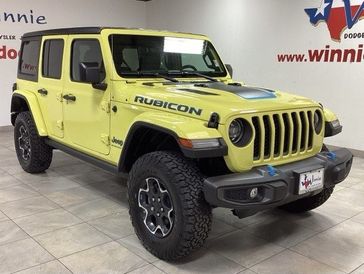 2023 Jeep Wrangler Rubicon 4xe in a High Velocity Clear Coat exterior color and Blackinterior. Wnnie Dodge 000-000-0000 pixelmotiondemo.com 