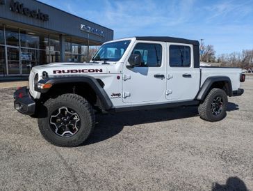 2022 Jeep Gladiator Rubicon in a Bright White Clear Coat exterior color and Blackinterior. Weeks Chrysler - Jeep Dodge 618-603-2267 weekschryslerjeep.com 