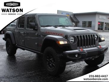 2023 Jeep Gladiator Mojave in a STING__GRAY exterior color and Blackinterior. Watson Benzie, LLC 231-383-7836 watsonchryslerdodgejeep.com 
