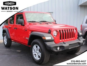 2021 Jeep Wrangler Unlimited Sport S in a Firecracker Red Clear Coat exterior color and Blackinterior. Watson Benzie, LLC 231-383-7836 watsonchryslerdodgejeep.com 