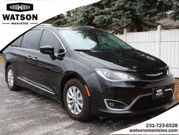 2018 Chrysler Pacifica Touring L in a Brilliant Black Crystal Pearl Coat exterior color and Black/Alloyinterior. Watson's Manistee Chrysler Inc 231-299-8691 watsonsmanisteechrysler.com 