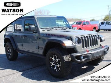 2021 Jeep Wrangler Unlimited Rubicon in a GRANITE exterior color and Blackinterior. Watson's Manistee Chrysler Inc 231-299-8691 watsonsmanisteechrysler.com 