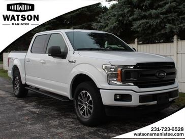 2019 Ford F-150 XLT in a Oxford White exterior color and Blackinterior. Watson Ludington Chrysler 231-239-6355 
