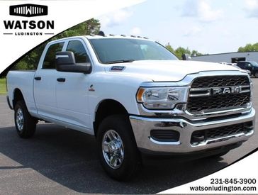 2023 RAM 2500 Tradesman Crew Cab 4x4 6'4' Box in a Bright White Clear Coat exterior color and Blackinterior. Watson Benzie, LLC 231-383-7836 watsonchryslerdodgejeep.com 