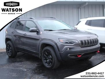 2020 Jeep Cherokee Trailhawk in a GRAY exterior color and Blackinterior. Watson's Manistee Chrysler Inc 231-299-8691 watsonsmanisteechrysler.com 