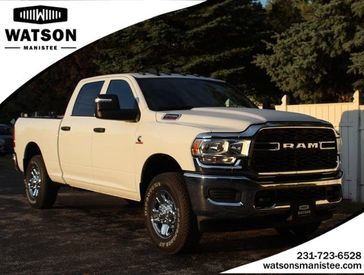 2024 RAM 2500 Tradesman Crew Cab 4x4 6'4' Box in a Bright White Clear Coat exterior color and Blackinterior. Watson's Manistee Chrysler Inc 231-299-8691 watsonsmanisteechrysler.com 