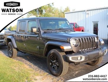 2021 Jeep Gladiator Sport S in a Granite Crystal Metallic Clear Coat exterior color and Blackinterior. Watson's Manistee Chrysler Inc 231-299-8691 watsonsmanisteechrysler.com 