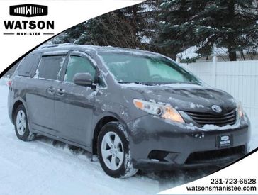 2015 Toyota Sienna LE AAS in a Predawn Gray Mica exterior color and Ashinterior. Watson Auto 000-000-0000 
