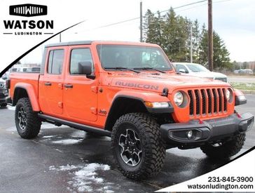 2023 Jeep Gladiator Rubicon 4x4 in a Punkn Metallic Clear Coat exterior color and Blackinterior. Watson's Manistee Chrysler Inc 231-299-8691 watsonsmanisteechrysler.com 