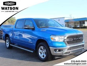 2021 RAM 1500 Big Horn in a BLUE exterior color and Diesel Gray/Blackinterior. Watson Benzie, LLC 231-383-7836 watsonchryslerdodgejeep.com 