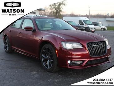 2022 Chrysler 300 Touring L in a Velvet Red Pearl Coat exterior color and Linen/Blackinterior. Watson Benzie, LLC 231-383-7836 watsonchryslerdodgejeep.com 