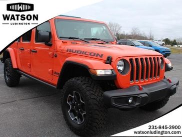 2023 Jeep Gladiator Rubicon 4x4 in a Punkn Metallic Clear Coat exterior color and Blackinterior. Watson's Manistee Chrysler Inc 231-299-8691 watsonsmanisteechrysler.com 
