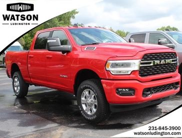 2023 RAM 2500 Big Horn Crew Cab 4x4 6'4' Box in a Flame Red Clear Coat exterior color and Blackinterior. Watson's Manistee Chrysler Inc 231-299-8691 watsonsmanisteechrysler.com 