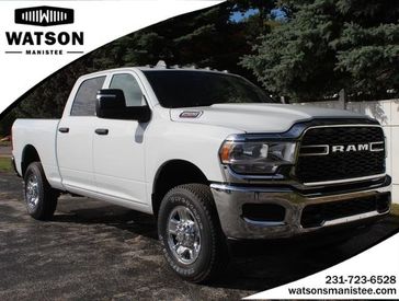 2024 RAM 2500 Tradesman Crew Cab 4x4 6'4' Box in a Bright White Clear Coat exterior color and Blackinterior. Watson's Manistee Chrysler Inc 231-299-8691 watsonsmanisteechrysler.com 