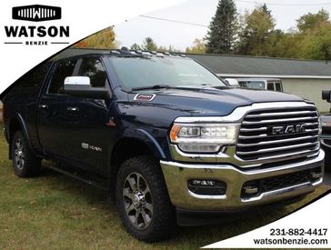2021 RAM 2500 Longhorn in a Patriot Blue Pearl Coat exterior color and Cattle Tan/Blackinterior. Watson Ludington Chrysler 231-239-6355 