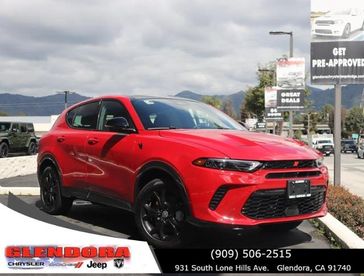 2024 Dodge Hornet R/T Plus Eawd in a Hot Tamale exterior color. Glendora Chrysler Dodge Jeep Ram 909-506-2515 glendorachryslerjeepdodge.com 