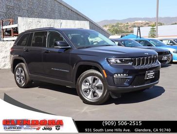 2024 Jeep Grand Cherokee 4xe in a Midnight Sky exterior color. Glendora Chrysler Dodge Jeep Ram 909-506-2515 glendorachryslerjeepdodge.com 