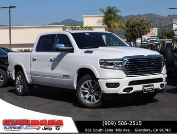 2024 RAM 1500 Limited Longhorn Crew Cab 4x4 5'7' Box in a Ivory White Tri Coat Pearl Coat exterior color and Browninterior. Glendora Chrysler Dodge Jeep Ram 909-506-2515 glendorachryslerjeepdodge.com 