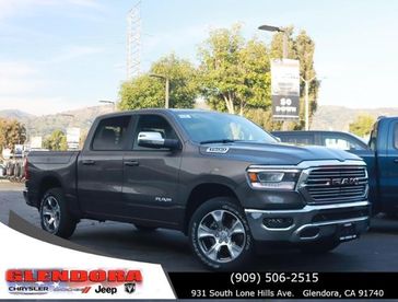 2024 RAM 1500 Laramie Crew Cab 4x4 5'7' Box in a Granite Crystal Metallic Clear Coat exterior color. Glendora Chrysler Dodge Jeep Ram 909-506-2515 glendorachryslerjeepdodge.com 