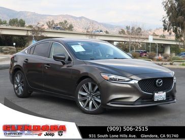 2018 Mazda Mazda6 Grand Touring in a GRANITE exterior color. Glendora Chrysler Dodge Jeep Ram 909-506-2515 glendorachryslerjeepdodge.com 