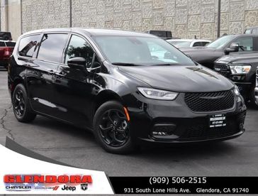 2023 Chrysler Pacifica Plug-in Hybrid Touring L in a Brilliant Black Crystal Pearl Coat exterior color. Glendora Chrysler Dodge Jeep Ram 909-506-2515 glendorachryslerjeepdodge.com 